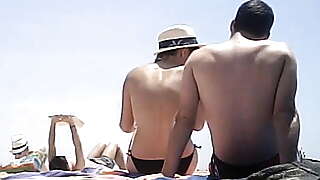 Topless putting on lotion