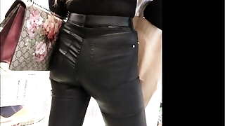 Candid voyeur thight leather ass girl
