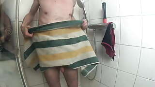 guy again in his red speedo in shower