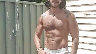 Hairy inked showing off outdoors