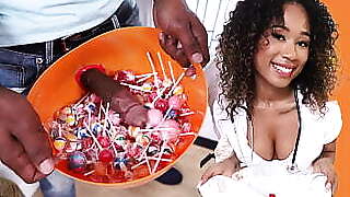Black girl dressed with a nurse costume collecting more than just candies at this house...