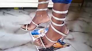 Girl stomping on paper in high heels, picture temple in heels, paper crush in high heels, heels stomping trampling