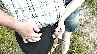 Random man pees. My slut wife saw random man on street who wanted to pee. Wife came up to him, unzipped pants and held his peeing dick in fingers. Naked men dressed women. Public. Outdoor. Outside. MILF. Beauty. Short skirt. Handjob. Fingering. In public